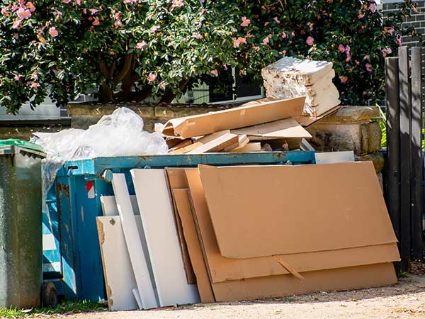 garbage receptacle overflow cardboard and drywall removal